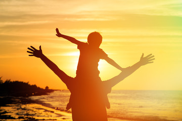 Fototapeta premium father and son having fun on sunset