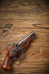 pirate pistol on aged wood