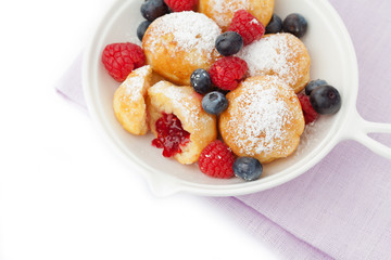 Traditional danish pancakes - ebelskivers with fresh berries