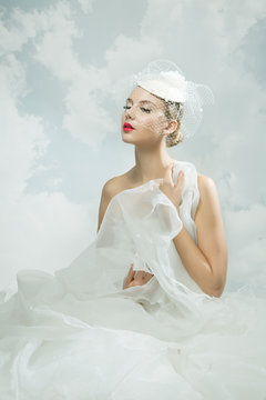 Bride over the sky background. Vintage style.
