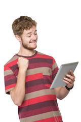 excited young man using tablet pc