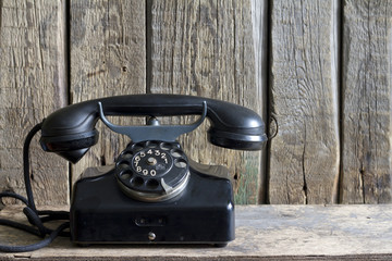 Old retro telephone on vintage boards