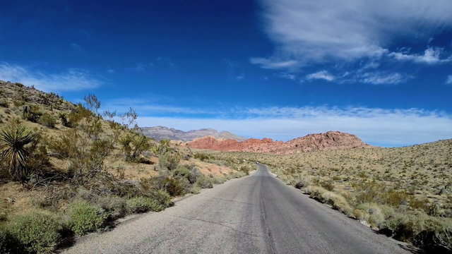 POV vehicle driving Red Rock Route 159 Conservation area desert Nevada USA