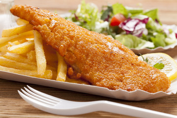 Fried fish and chips on a paper tray