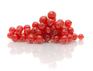 ripe juicy red currant berries on a white background with reflec