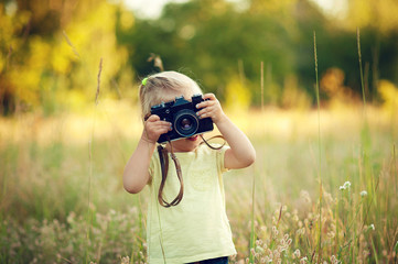 child with camera
