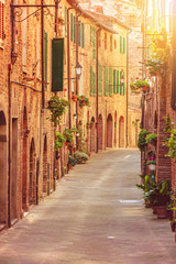 Fototapeta na wymiar Old beautiful Tuscan streets in the Italian town