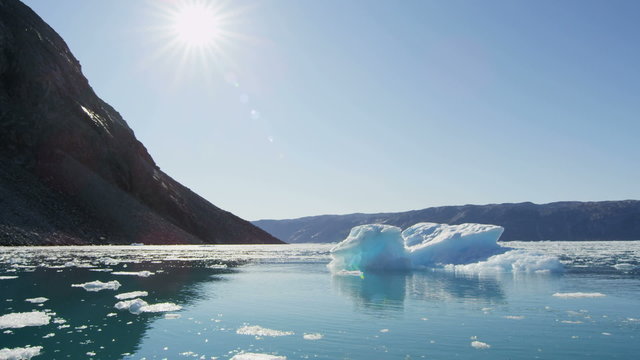 Icefjord landscape iceberg climate change sun flare Disko Bay