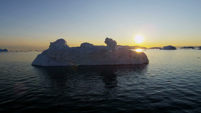 Disko Bay sunset Greenland floating glacial iceberg frozen 