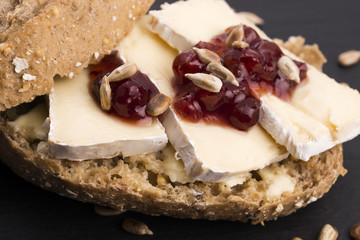 bread served with camembert and cranberry