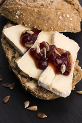 bread served with camembert and cranberry
