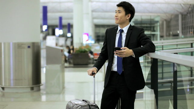 Male Asian Ethnic Business Traveller Airport Wireless Smart Phone
