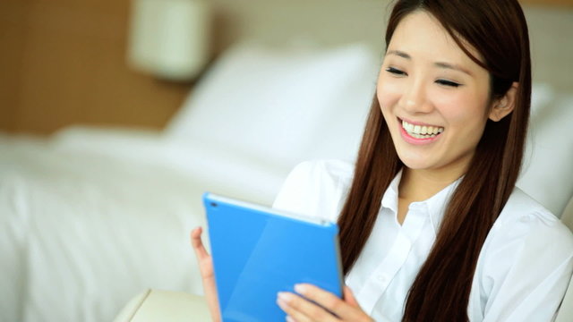 Successful Asian Chinese Businesswoman Leisure Tablet Device Hotel