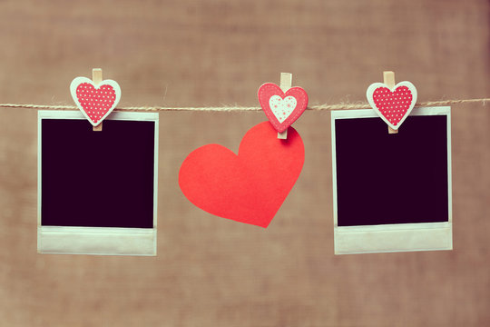 Two polaroid photo frames and heart for valentines day on vintag
