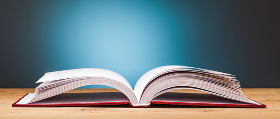 book on wooden table
