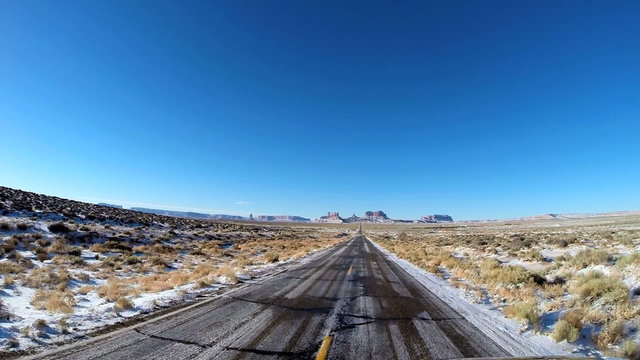 POV driving Buttes winter snow Colorado Plateau Monument Valley Arizona USA