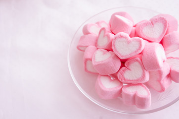 Pink heart marshmallow  in glass dish