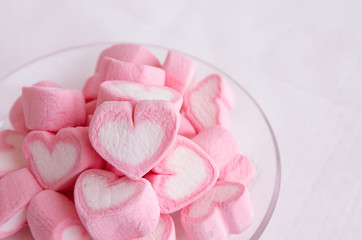Fototapeta na wymiar Pink heart marshmallow in glass dish