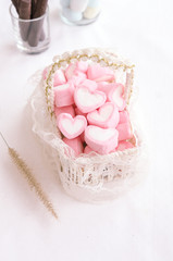 Fototapeta na wymiar Pink heart marshmallow in Vintage basket