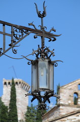 Fototapeta na wymiar Medieval street lamp in Assisi, Italy