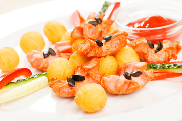 fried potato balls with sausage
