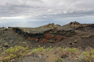 Fototapeta na wymiar La Palma volcanic lava black stones in Canary Islands