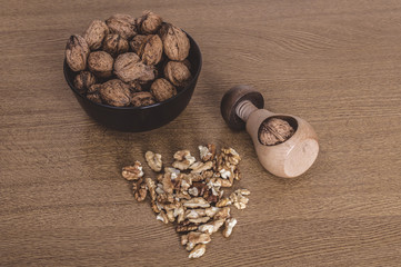 Nutcracker and walnuts in a wooden table