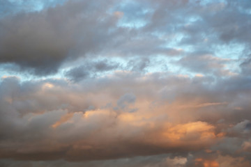 Naklejka na ściany i meble Clouds at sunset.