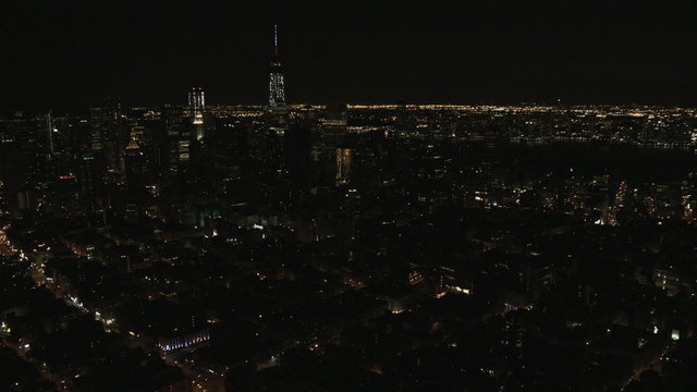 Aerial Manhattan illuminated 1 WTC Brooklyn Bridge Skyscrapers New York