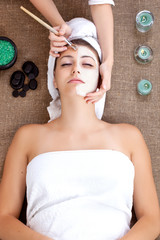 Obraz na płótnie Canvas mask, massage of face for woman in spa salon