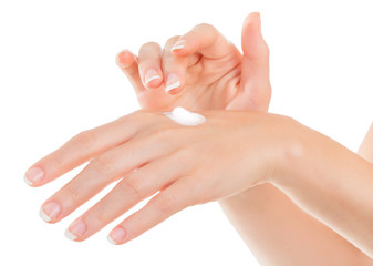 Beautiful young woman hands with cream, isolated on white