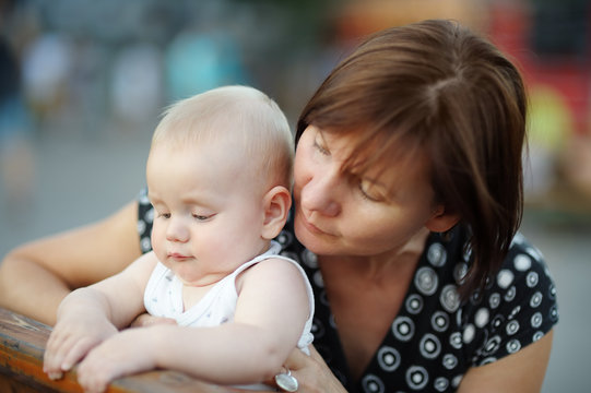 Middle aged woman and her adorable little grandson