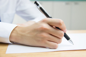 Businessman signing documents in the office