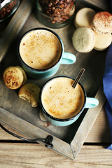 Beautiful composition with tasty cappuccino on wooden table