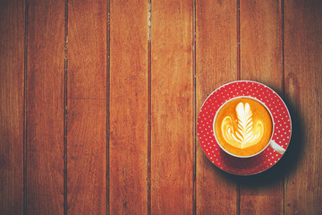 cup of coffee on the wooden desk