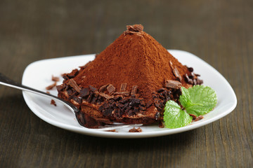 Yummy chocolate cupcake on table