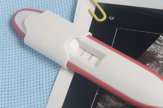 Pregnancy Test Pack At Blue Background