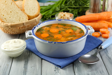 Composition with carrot soup, ingredients and herbs