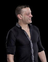 Laughing man looking aside