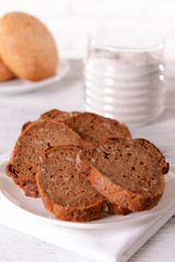 Tasty bread on table on light background