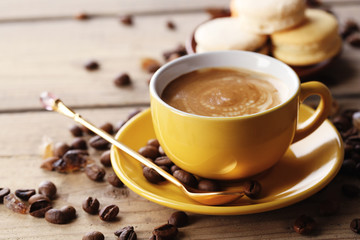 Gentle colorful macaroons and  coffee in mug