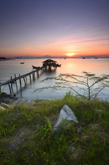 fisherman's cottage and pier at sunrise