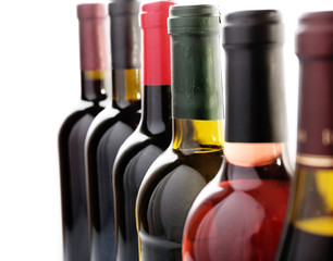 Wine bottles in row isolated on white
