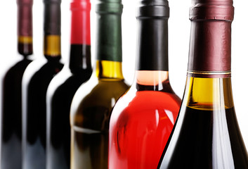 Wine bottles in row close-up