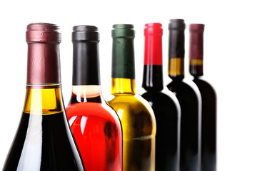 Wine bottles in row isolated on white