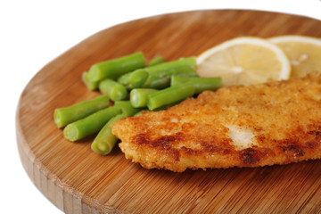 Breaded fried fish fillet and potatoes with asparagus and