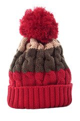 Red knitted pattern winter bobble ski knit hat isolated white background photo