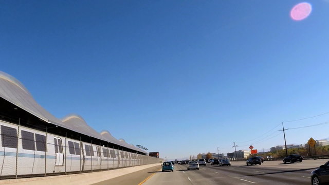POV drive vehicle city metro train station built structure California USA