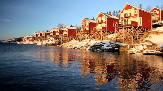 Norwegian Fjord nr Tromso shoreline houses fading sunlight seascape 