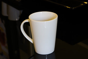 White mug on black table